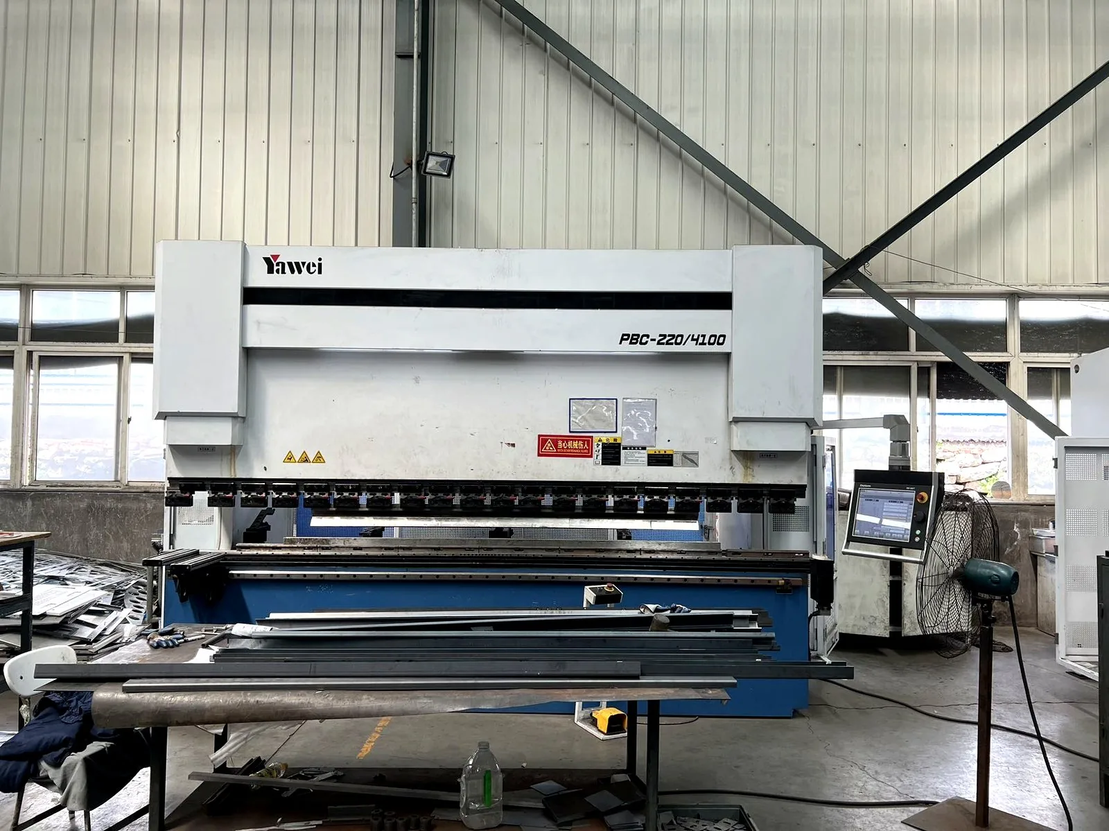 CNC machining center working on a chamber frame